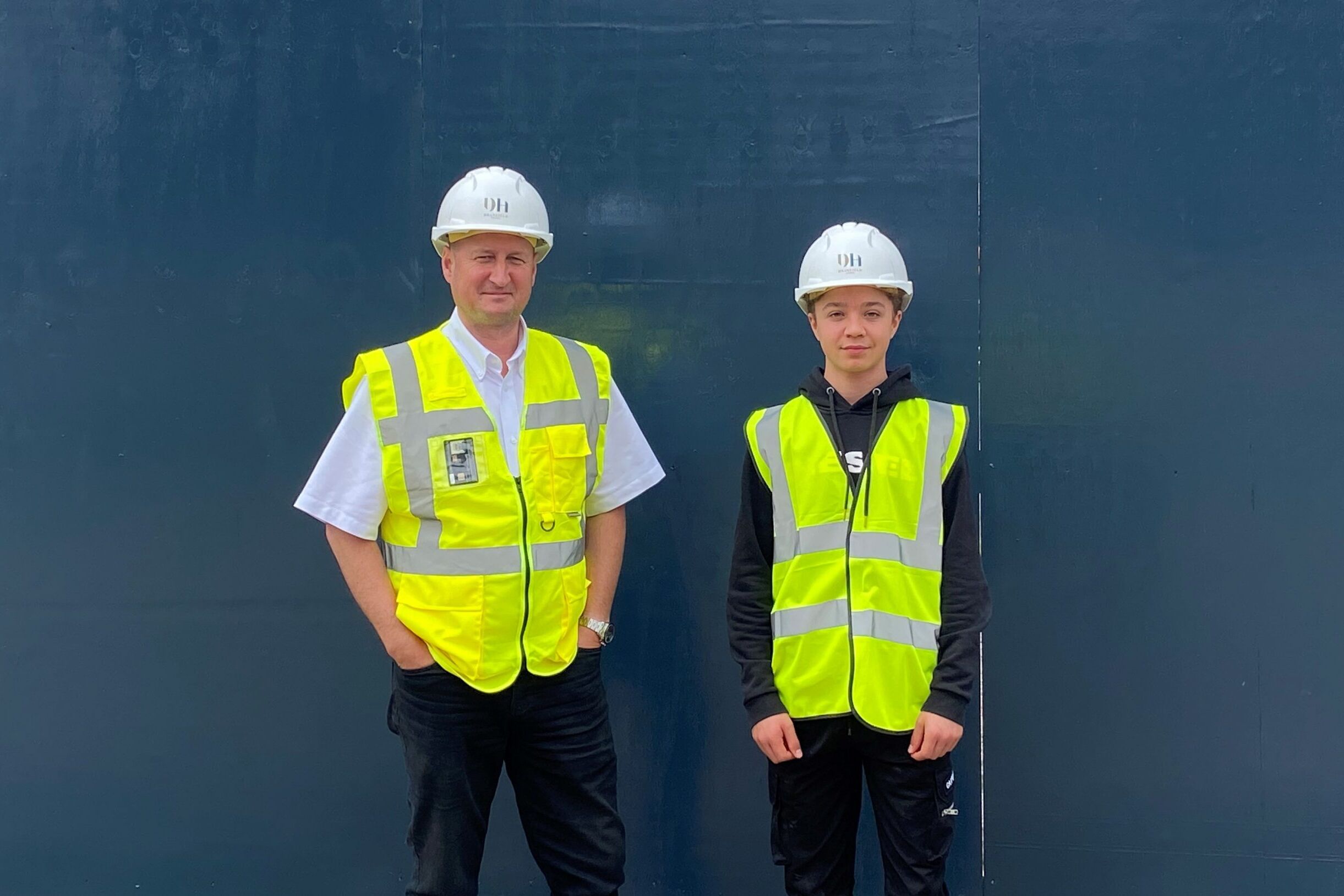 Work experience man in high vis and hat